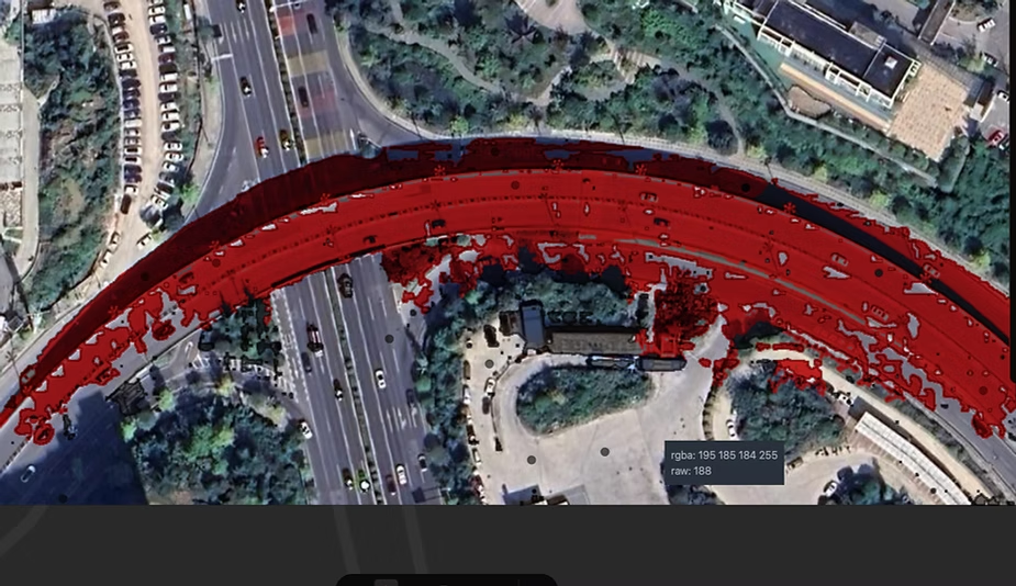 FastSAM road segmentation on a satellite highway interchange, showing a red overlay with many gaps and holes in the segmented road